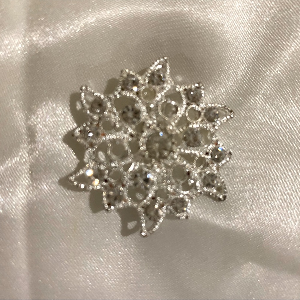 Two brooches-One Tulip Shaped the other Circular